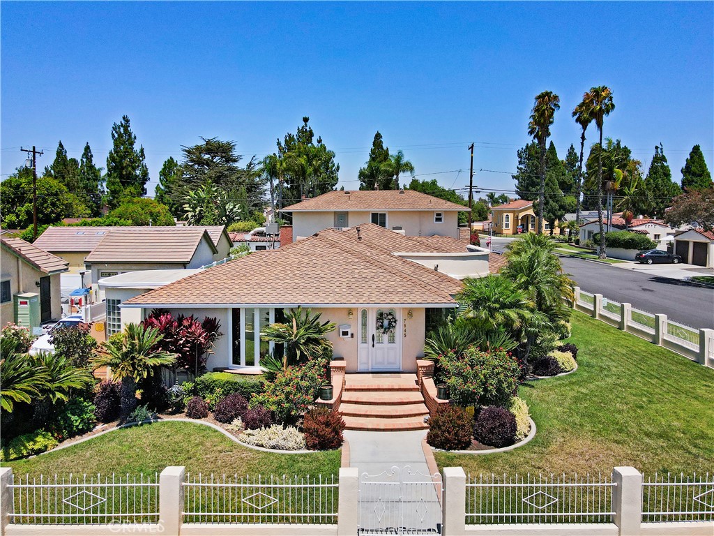 Meticulously maintained and manicured custom home in desirable Orange Estates including a beautiful 1 bedroom unit over 4 car garage. This lovely corner home is move in ready! Large formal entry opens to spacious living room with custom wet bar area. Wood shutters adorn the bay window, the ceiling has a unique design, combined with a glass brick wall and wood flooring. Formal dining room has a built-in wet bar with wine area, bow window. Gourmet kitchen has built in refrigerator, microwave, and double ovens and granite counters and beautiful tile floors. Cozy family room has gas burning fireplace. Remodeled baths and spacious bedroom. One bedroom is currently used as an office with built in desk and cabinets. This home has tons of custom cabinetry and closets for optimal storage. Beautiful covered breezeway leads to outside laundry and garage. Above the 4 car garage is a spacious 1 bedroom unit with living room and kitchen which is approximately 600 sq. ft. It has central air and heat.. Adjacent to the unit is a large storage area ( approximately 200 sq.ft.). This space can be utilized as a 2nd bedroom for the upstairs unit!
Manicured rear yard has synthetic grass for easy maintenance. Additional amenities include central air, and security system.
Don't miss this opportunity to make this home yours!