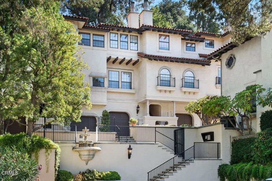 Welcome to the Altos Arroyos, a dreamy Mediterranean villa scenically situated on the banks of the Arroyo Seco. This sophisticated, chic three-bed, three-bath townhouse boasts dramatic panoramic views of the Arroyo Seco and the San Rafael Hills.The upper level includes a spacious living room with a vaulted ceiling, dramatic views, and an oversized gas-burning fireplace. Elegant finishes like stone columns, a dazzling crystal chandelier, and a wet bar with shimmering glass cabinetry welcome you into the dining room. Outside is a large patio, perfect for entertaining. The gourmet kitchen features an island with bar seating and a breakfast nook, showcasing the townhouse's panoramic views. A third bedroom is used as a den and has a three-quarter bathroom nearby.You can either take the leopard print staircase or the personal, elegant elevator to all levels.The middle level has two large bedroom suites. The primary suite has a gas fireplace, plantation shutters, and a peaceful atmosphere. Both bedrooms have large closets with full baths. Speaking of large closets, there is an opulent custom walk-in closet tucked away for privacy.The lower level is at ground level, featuring two private garages with storage rooms. Fine appointments include leaded glass elevator doors, recessed lighting throughout, vaulted ceilings, abundant storage, a laundry room with a side-by-side washer and dryer, and copper plumbing. The Altos Arroyos has numerous guest parking spaces, a security gate, privacy, serene fountains, and a sparkling community pool. 70 N. Arroyo is a prime location for an active Pasadena lifestyle. The Altos Arroyos is adjacent to the Rose Bowl, Aquatic Center, Brookside Park, bike trails, hiking, archery, South Orange Grove Blvd., and Colorado Blvd.