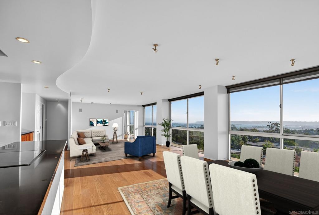 Welcome to this beautifully appointed 2-bedroom, 2-bath condo perched on the 9th floor in the heart of Bankers Hill. This light-filled residence showcases sweeping city and bay views through dramatic floor-to-ceiling windows and from your private balcony. The open-concept layout features a modern kitchen with stainless steel appliances, upgraded finishes throughout, and in-unit laundry for ultimate convenience. The building offers a gorgeous rooftop with a gym and community space, providing 360-degree views of San Diego. Enjoy two secure garage parking spaces and easy access to some of the city’s best neighborhoods including Balboa Park, Little Italy, and the downtown waterfront. This is upscale urban living at its finest.