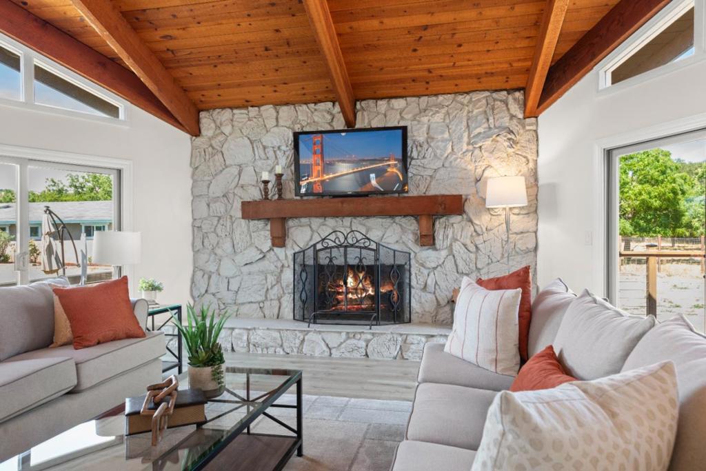 Calm of the country with convenience of the city. Close to wineries, the Outlets, and miles of hiking. A stunning property that offers the perfect blend. Nestled on 2.5 flat and usable acres, this upgraded 2,254 sq. ft. single level presents a 4-BD 3 BA retreat. Expansive great room with open beam ceiling, floor to ceiling fireplace and sliders opening to the rear decks. Stylish kitchen boasts fresh cabinetry, quartz counters and tile backsplash, a 5-burner gas range with Thermador hood and farm-style sink. Enjoy the pasture view from the eat-in kitchen space, pull up a stool to the breakfast bar, or watch the kiddos play in the back yard pristine pool from the great room dining area. The primary retreat with walk-in closet opens to a deck and hot tub for recharging the batteries. The home also boasts 2 updated bathrooms, new designer light fixtures, ceiling fans, whole home attic fan, 2-zone AC/heating, new laminate/LV flooring and separate laundry room. An equestrians dream with 5 stalls and a wash rack. Let your imagination run wild with the outer building next to the pool that can serve as a pool house, he/she shed, or you may even want to check on ADU possibilities. Come experience the beauty and tranquility of country life in Gilroy. You wont be disappointed.