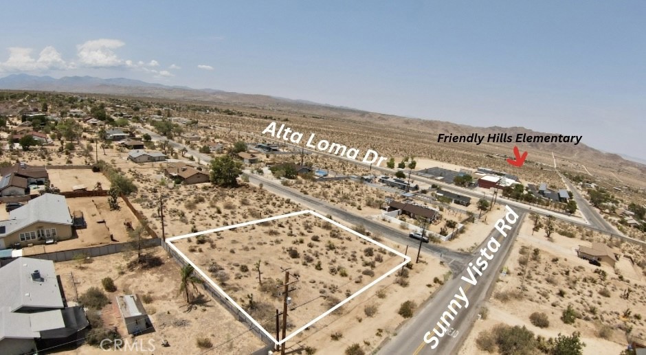 Rare Corner Lot with Utilities in Upper Friendly Hills – Joshua Tree, CA
Positioned in one of Joshua Tree’s most desirable neighborhoods, this just-under-half-acre corner lot in Upper Friendly Hills combines convenience, natural beauty, and investment potential. With water and power already in the street, the groundwork for your desert dream build is ready to go.
Enjoy panoramic views in every direction, offering breathtaking sunrises, sunsets, and star-filled night skies. The property feels private and serene, yet remains ideally located—just minutes to both Yucca Valley and Joshua Tree’s town amenities, and only a short drive to the Joshua Tree National Park entrance. Adding to the appeal, Friendly Hills Elementary School is right down the road, enhancing both the livability and future value of this parcel. Whether you’re looking to design your custom desert retreat, create a short-term rental investment, or simply secure your own slice of the rapidly growing Hi-Desert, this lot offers unmatched potential in a location that continues to soar in popularity.
Topography survey in place. All lot lines in photos are approximate. Buyer to verify access to utilities through due diligence.