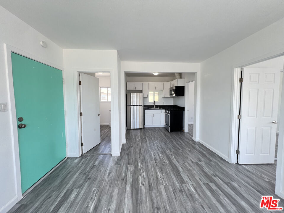 Welcome to this cozy 2-bedroom apartment in a 4-unit building in the heart of Los Angeles. With approximately 800 sq. ft. of living space, this move-in-ready home offers a comfortable and functional layout in a convenient location near the Crenshaw Metro Rail Line. The apartment features a bright living area and a kitchen equipped with a stove, refrigerator, and microwave. Both bedrooms offer ample closet space and a comfortable layout for everyday living. Parking is available with two spaces for $50/month. Tenants are responsible for electricity, gas, trash, renters' insurance, and any additional services they may need. Located near Leimert Park Village, Baldwin Hills, and Downtown Inglewood, this apartment offers easy access to shopping, dining, and public transportation a cozy, move-in-ready home in a central Los Angeles location.