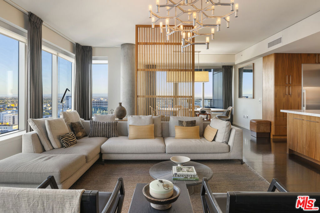 Stunning remodeled home-in-the-sky sited on the desirable S/W corner of EVO in the Social District of DTLA. Rich bespoke woodwork greets you as you enter and upgraded wood floors run throughout. Walls of glass with custom window treatments surround the large open living and dining areas. Custom kitchen included marble counters, additional cabinetry, top-tier stainless appliances and a walk-in pantry complete the space. Ensuite guest room boasts more custom woodwork and window treatments framing the gorgeous sunset views. The large Primary Suite includes more beautiful wood and window treatments, a huge walk-in closet and generous spa-like bath. Building amenities include a state-of-the-art fitness center, a 24th-floor residents' lounge with view terrace and a 6th-floor outdoor terrace with glistening pool, spa, sundeck, BBQ grills, and a full kitchen area with flat-screen TVs. Situated on arguably the best block in DTLA, this vibrant neighborhood features Pine & Crane, Orange Theory Fitness, South Park Pharmacy, Starbucks and more. Plus, you're just moments away from the Crypto.com Arena, LA Live, Ritz-Carlton, and the Pico Metro Station, making commuting a breeze. With a Walk Score of 95 and a Transit Score of 100, you may never need a car again. Downtown LA is undergoing major transformations in preparation for the 2028 Summer Olympics, with billions being invested into development, including new infrastructure and upgrades. Buy into the future of LA today!