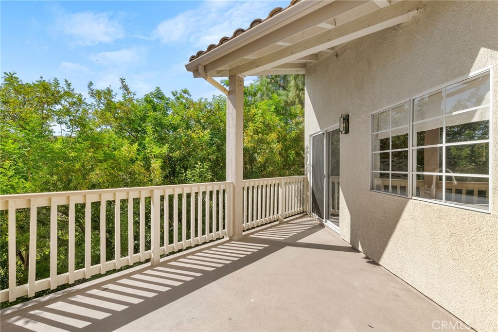 Wonderful, move in ready 2 bedroom 2 bath condo with a view in the heart of Oak Park! Located on the second floor with no one above you, this condo spans over 1100 square feet, & features 2 balconies facing a private view of the surrounding hills & nature. Once you step inside you will notice the high vaulted ceilings & abundance of natural light. Wood like floor & all new recessed lights through out. Open living room with fireplace leads adjacent to the dining area. Kitchen features stainless steel appliances with Fridge included. 2 full bathrooms with upgraded toilets. Primary bedroom with its own primary bathroom, walk in closet + its own private balcony. Laundry closet with washer & dryer included. 2 covered parking spots are included. Some HOA amenities include pool/ spa, gym, racquetball court, tennis court, basketball court, clubhouse & near by hiking trails. Walking distance to the highly acclaimed Oak Park High School & Middle School + Oak Park Library .