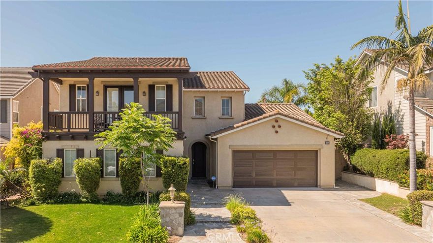 This stunning and inviting 4-bedroom, 3.5-bathroom property is ready for lease. As you enter, you are greeted by a grand entryway with a vaulted ceiling over 15 feet high and elegant hanging ceiling lights, leading to an open floor plan. The spacious family room, perfect for gatherings, is filled with natural light from numerous large windows throughout the home. To the left of the entryway, the modern kitchen boasts granite countertops, a generously-sized island with ample breakfast and bar-style seating, and opens to the dining area, living room, and a versatile den/office space that can easily be converted into an additional bedroom if desired. The first-floor bedroom (guest suite) features its own private bath, ideal for guests. Elegant roundabout stairs lead to the second floor, where you'll find a convenient separate laundry room and three additional bedrooms, including the primary suite. The primary suite accessed through double doors, is spacious and features a large private bathroom with separate his-and-hers walk-in closets, a separate bathtub and shower, vanity area, and dual sinks. The front-facing bedroom on the second floor offers access to a large balcony patio, perfect for enjoying sunny Southern California days and stargazing in the evenings. Additional features include French doors leading to a well-sized backyard, perfect for entertaining, and a unique, deep side-by-side two-car garage plus a separate one-car garage. The one-car garage offers flexibility for use as a workout or utility room. Lease terms negotiable.