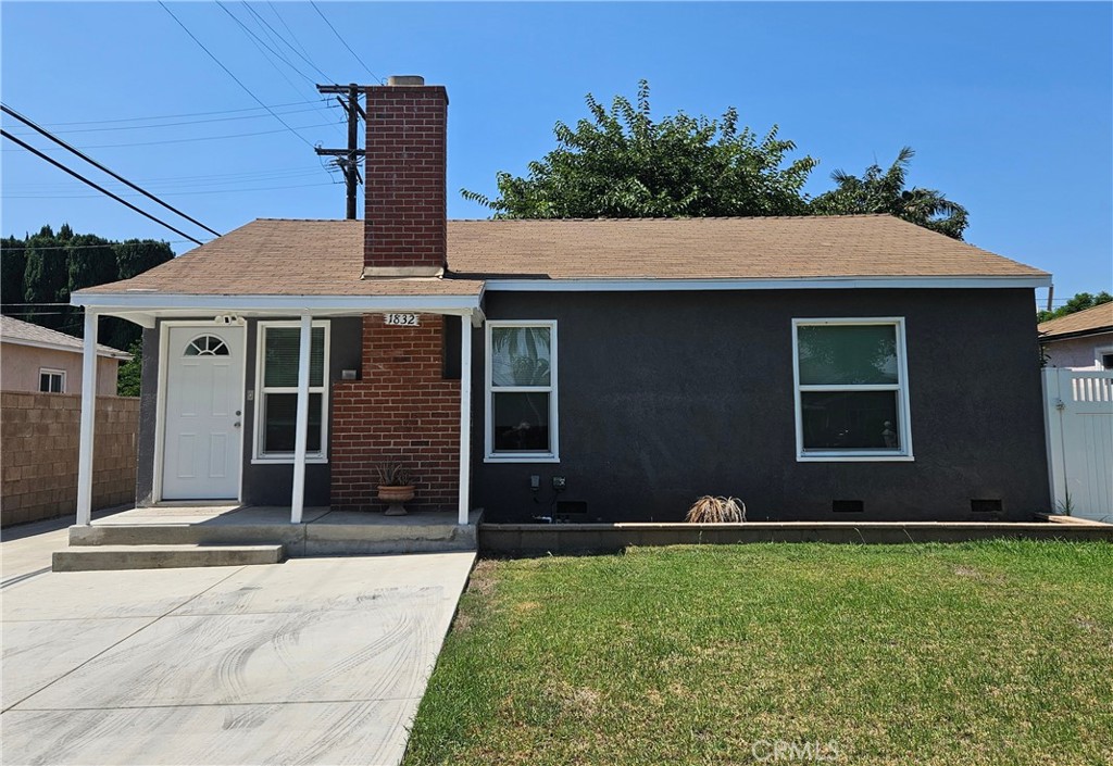 Bright sunny Updated mid century modern home with remodeled kitchen and bath, gleaming hardwood floors and newer stove, range hood , washer and dryer in inside laundry room. Fireplace in the living room, built in cabinets and window seat in the dining room built in closets and drawers in the bedrooms. 2 car detached garage, with long drieway, extra parking space in front and large block wall fenced back yard with huge shade tree. Light neutral interior ready for a new tenant.