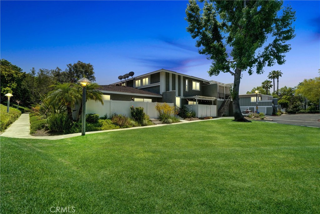 Welcome to 23018 Via Cereza #A1, Mission Viejo – a rare single-level, corner-unit condo nestled in a peaceful interior location on a tree-lined street. This 3-bedroom, 2-bath home offers 1,141 sq ft of inviting living space, a spacious 1-car garage with extra side storage and built-in racks, and an additional assigned parking spot. Backing onto a lush greenbelt, this property stands out as one of the few units in the community featuring two private patio areas, ideal for outdoor relaxation and entertaining. As you approach, you’re greeted by beautifully manicured landscaping. Inside, the home is filled with natural light and boasts a spacious open-concept layout. The kitchen and dining area open directly to the first patio, ideal for seamless indoor-outdoor living. The living room flows seamlessly into the dining area and updated kitchen, complete with a new stove and range, tile counters, natural wood cabinetry, and a classic subway tile backsplash. A laundry closet with washer/dryer and pantry add everyday convenience. The primary suite offers direct access to the second patio, a walk-in closet, and an En-suite bath with a walk-in shower and newer glass enclosure. Two additional bedrooms and a full hall bath with shower-over-tub complete the floor plan. Interior upgrades include new paint, upgraded baseboards, newer Luxury Vinyl plank flooring in the bedrooms, tile flooring in the main living areas, ceiling fans, central AC, and a newer water heater. The outdoor patios have been enhanced with new vinyl fencing and enjoy direct access to the scenic community walkways. The home is conveniently located across the street from the community pool, spa, and playground. Residents of Aliso Villas enjoy access to resort-style amenities including a sparkling pool, spa, clubhouse, playground, and scenic walking paths. As a member of Lake Mission Viejo, you’ll also have access to a private lake with beaches, boat rentals, fishing, concerts, and family-friendly events throughout the year. Don’t miss this beautifully maintained, light-filled home in a serene Mission Viejo community close to parks, shopping, schools, and freeways.