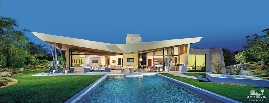 New contemporary construction on the Canyons course. This Guy Dreier designed home feature 4 bedrooms and 4 1/2 baths. Cul-de-sac lot with panoramic views of the valley floor and Eisenhower Mountain. The private courtyard entry leads to glass front doors opening to the great room. The pocket sliders in the great room and kitchen blur the lines of indoor and outdoor living. A large entertainment patio off the great room features southern mountain views and a large pool and spa. The master bedroom features breathtaking down valley views and a private spa for the owners to take in the the valley views. Off the master is a spacious and sophisticated office. The 2 interior suites are separated by a spacious living area for your guests. The guest suites feature fully appointed baths. The guest house features include a sitting room, fully appointed bath with double vanities, and access to the entertainment patio and pool/spa.