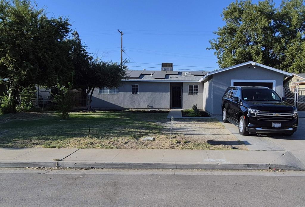 **Seller may credit up to $6,000 toward buyer’s closing costs and/or rate buydown (subject to lender guidelines; no cash to buyer)** Pull up to a fresh new exterior: full-home stucco with crisp painted trim, doors, and eaves that set the tone. Step inside to a light, open feel with wood-look porcelain tile flooring carrying through the main spaces. The updated kitchen anchors daily living—clean lines and easy workflow—while renovated bathrooms feature tiled shower surrounds and a coordinated bath backsplash for a polished finish. Outdoors, enjoy a spacious lot with room for projects or play (buyer to verify any intended use with the County). Energy feature: leased Sunrun solar—16 panels (buyer to assume $181/mo with 3.5% annual escalator; see docs for details). Convenient access to Hwy 145 and Avenue 12 ? CA-99 keeps commuting simple. Area maps indicate a mapped flood zone—buyer to verify insurance requirements with lender/insurer. Buyer to verify all information.
