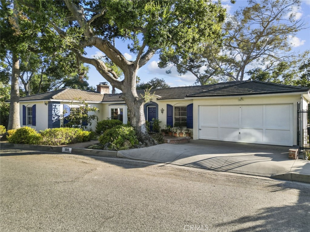 Nestled in the prestigious Royal area of Glendale, this beautifully maintained Cape Cod residence offers an exceptional blend of comfort, charm, and natural serenity. Spanning over 2700 square feet, this 4-bedroom, 3-bathroom home is ideally positioned in a peaceful setting with breathtaking views of the canyon and surrounding mountains. The interior features spacious living and dining areas filled with natural light, creating an inviting ambiance perfect for everyday living or elegant entertaining. Recent upgrades include a newer roof, tankless water heater, and HVAC system, offering peace of mind and modern efficiency. Surrounded by mature trees and lush landscaping, this home provides a rare opportunity to live in one of Glendale's most sought-after neighborhoods, just moments from top-rated schools, parks, and local amenities.