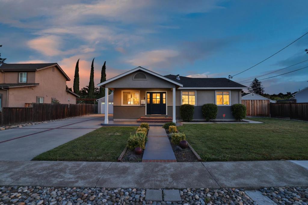 Experience a custom-designed and meticulously remodeled home perfectly suited for modern living. Main House: 4 BD/2BA WITH 1552 SFT, ADU 1/1 WITH 370 SFT PLUS A COVERED OUTDOOR LIVING SPACE W/ 806 SFT. An open and inviting layout centered around a stunning kitchen w/ a massive island with bar seating, top-of-the-line appliances, custom cabinetry & pantry. The home boasts a spacious family room, beautifully updated & skylight-filled bathrooms, 4 bedrooms including a primary suite with dual skylights & access to the outdoor space. Enjoy the comfort of a new HVAC system, and convenience of a dedicated laundry room, energy efficiency from solar panels and upgraded service panel. This expansive backyard showcases luxury outdoor living at its finest. A beautifully designed BBQ pavilion is the centerpiece, complete with granite countertops, heaters 6 skylights that bring in natural light. Elegant stone flooring flows throughout the 1,425 sf patio, of which 806sf is covered & complemented by the fireplace. A full bocce ball court, plus raised garden beds provide fresh vegetables just steps from the kitchen. The 1bd/1b 370sf ADU studio is perfect for guests or easy to rent for additional income. Located in the heart of Silicon Valley, a truly exceptional place to call home!