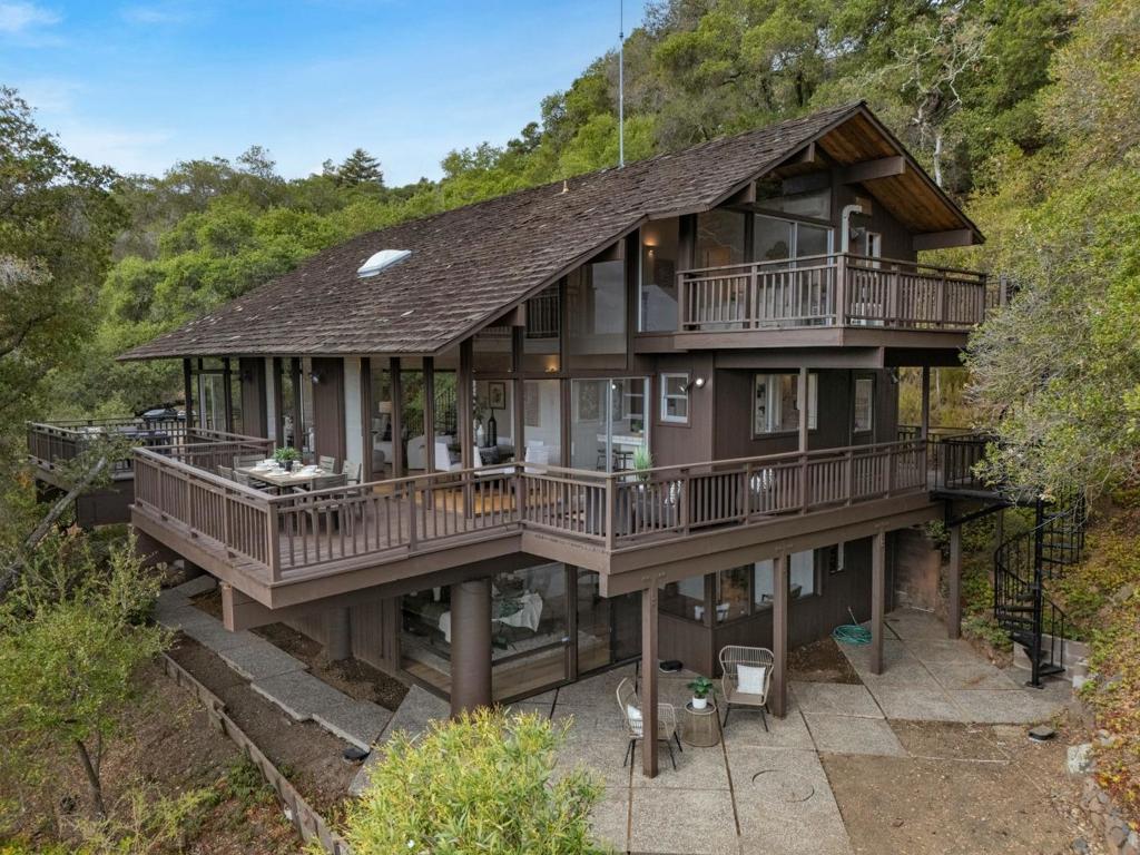 Escape the ordinary at 435 Golden Oak Drive, an architecturally distinct 4-bedroom, 3.5-bath retreat in one of Portola Valleys most coveted enclaves. Set on nearly 1.5 acres at the end of a private drive, this residence offers rare privacy while still being minutes from Silicon Valley conveniences. Expansive windows fill the home with natural light and frame the surrounding landscape. Multiple decks across different levels create seamless indoor-outdoor living and provide inviting spaces for morning coffee, evening wine, or entertaining. The interior has been refreshed with new flooring and paint throughout, creating a clean, modern backdrop. The layout offers flexibility for family living, hosting, or working from home, with generous bedrooms and well-placed common areas. Located in an exclusive neighborhood known for its beauty, privacy, and top-rated schools, the property is also walking distance to the iconic Alpine Inn. Nearby are some of the Peninsulas most prestigious country clubs offering golf, tennis, dining, and social amenities. A rare opportunity to own a true retreat in the heart of the Peninsula.
