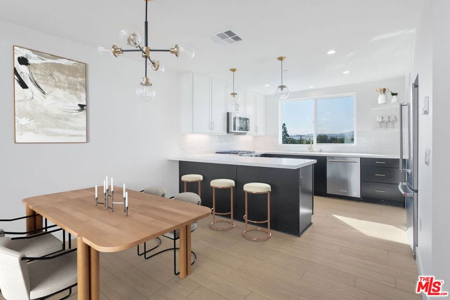 Welcome to Lyon Lane NoHo, an exclusive enclave of 16 modern townhomes in the heart of North Hollywood. 11224 W. Lyon Lane offers approximately 1,800 SF of refined living space, featuring 3 bedrooms, 3.5 bathrooms, and a versatile fourth-floor flex space. This thoughtfully designed home showcases double-height ceilings, Shaw hardwood flooring, JennAir appliances, Kent Moore cabinetry, and quartz countertops. The expansive kitchen with a walk-in pantry seamlessly opens to bright living areas framed by oversized windows, creating an inviting atmosphere for entertaining and everyday living. Each bedroom is ensuite, including a first-floor guest suite offering privacy and flexibility. The 2-car garage comes equipped with EV-pre wire. Whether you're seeking a primary residence or an investment opportunity, Lyon Lane NoHo delivers contemporary comfort, elevated design, and an unbeatable location.