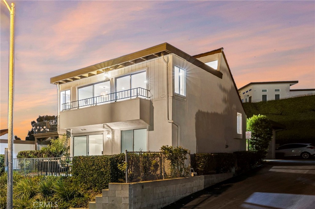 Enjoy panoramic ocean views from Dana Point Harbor all the way to Cottons Point! Discover the best of San Clemente in this beautifully updated 3-bedroom, 2.5-bathroom townhome located in the highly sought-after Ocean Hills community. The main living area is positioned upstairs to maximize ocean views, featuring an open-concept living and dining space that flows seamlessly to a spacious balcony—perfect for entertaining or enjoying stunning sunsets. The light-filled kitchen boasts crisp white cabinetry, stainless steel appliances, a wine fridge, and abundant natural light. Freshly painted interiors and new luxury vinyl flooring throughout create a clean, modern coastal aesthetic. Downstairs, two guest bedrooms share a full bath, with one offering direct access to a private ocean-view patio—a tranquil retreat to savor the coastal breeze. The primary suite features its own ensuite bath and opens to a serene courtyard patio, located between the home and detached two-car garage, which includes laundry. Residents of Ocean Hills enjoy resort-style amenities including two swimming pools, a 9-hole chip-and-putt golf course, and a premier location moments from shopping, dining, Trader Joe’s, and Starbucks. With the beach, pier, and downtown San Clemente just a short drive away, this home offers the ideal blend of style, comfort, and coastal charm.