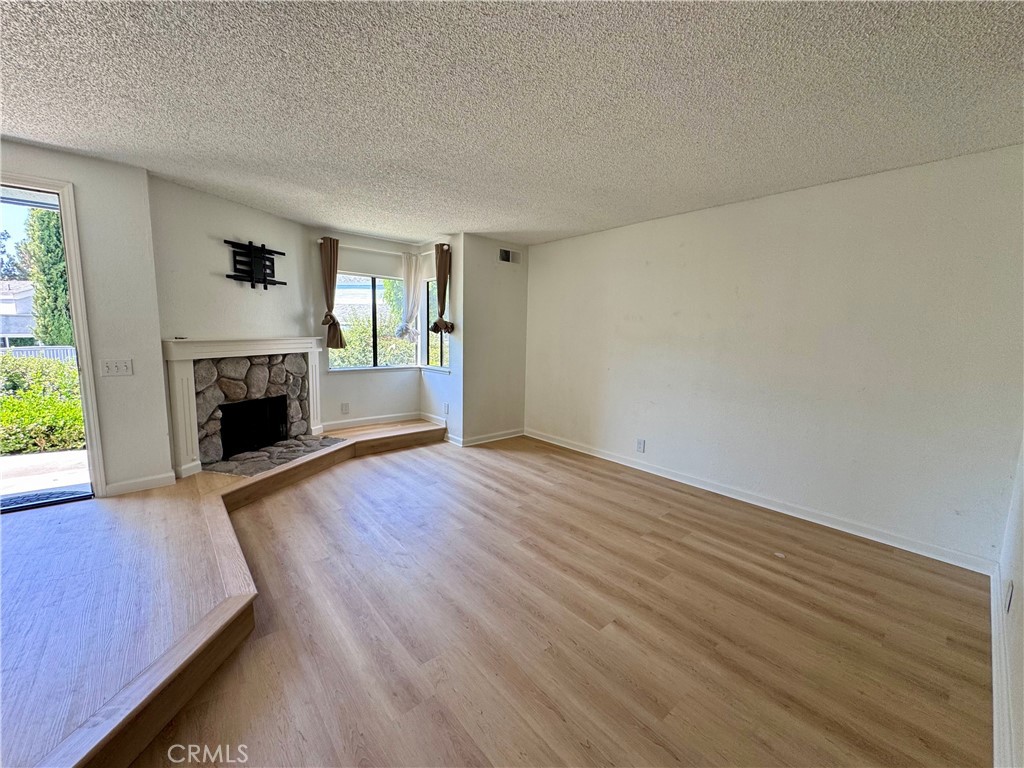 Welcome to this beautifully updated Sundance townhome in the heart of Northwood, Irvine. This quiet 3-bedroom, 2.5-bath unit sits along the greenbelt and is directly across from the community pool. The first floor features newly installed vinyl flooring, and the open layout allows for plenty of natural light throughout. Includes a spacious 2-car garage, new appliances, updated bathrooms, central A/C, recessed lighting, and designer finishes. Conveniently located within walking distance to Northwood Village Plaza and top-rated Irvine schools, with easy access to parks, trails, and major shopping centers.