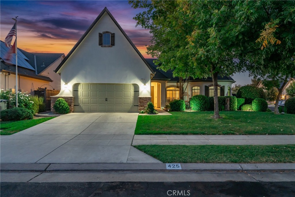 Your Clovis Luxury Lifestyle Begins Here! Discover elegance, comfort, and California charm in this stunning 4-bedroom, 2-bath Lennar masterpiece, perfectly positioned on a premium corner lot in one of Clovis's most coveted neighborhoods - with the award winning and highly sought after Buchanan High School right around the corner!
Step inside to soaring vaulted ceilings, sun-drenched spaces, and a dual-sided fireplace that creates warmth and sophistication in both the living and dining rooms. High-end details abound custom wooden blinds, rich crown molding, wide baseboards, and a designer color palette that feels timeless yet fresh.
The chef's kitchen is a true showpiece, featuring granite countertops, a professional six-burner gas cooktop, oven, microwave, two sinks, wine/beverage fridge, walk-in pantry, and smart storage upgrades. Recently added luxury appliances include a convection/microwave oven, dishwasher, faucets, garbage disposal, and a premium water heater.
Retreat to the spacious primary suite with its walk-in closet, spa-like bath, soaking tub, separate shower, and private French door access to your backyard oasis. Outdoors, enjoy alfresco dining beneath a charming pergola, savor fresh pomegranate, lemon, and orange trees, or harvest grapes, squash, tomatoes, peppers, basil, and oregano. Fragrant rose bushes add a romantic touch.
This is more than a home it's an upgrade to the way you live. Welcome to the best of Clovis.