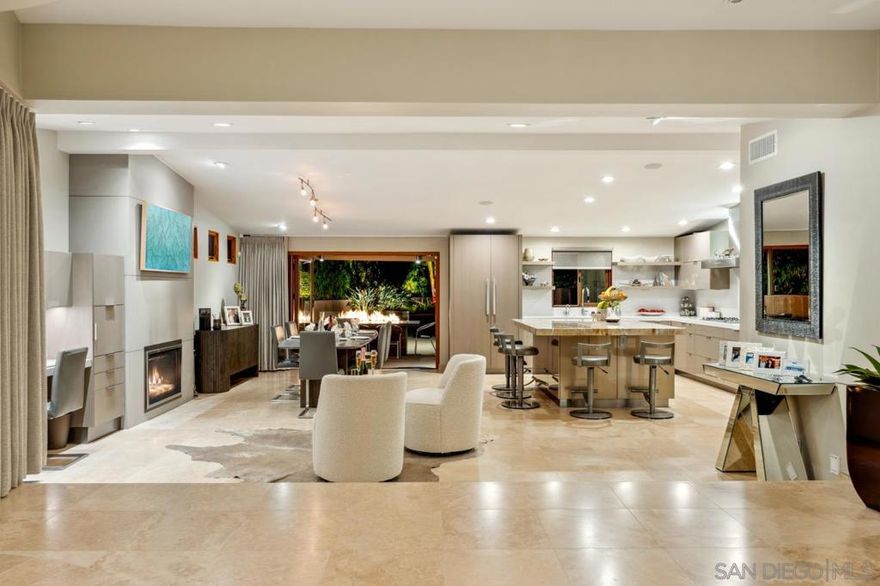 Experience the epitome of luxury living with this stunning FULLY FURNISHED contemporary home, just blocks from the beach and the iconic Del Mar Race Track. This one-story home with ocean views on a quiet street was designed for seamless indoor-outdoor living. The front of the home features a dramatic curved sliding glass wall that opens to an inviting front terrace with breathtaking coastal ocean views from La Jolla to the North Coast.  At dusk take the party to the rooftop deck to savor the ever changing sunsets, complete with cozy fire pit seating. The beautifully landscaped backyard is a private retreat, offering a built-in jacuzzi and dramatic fire table to dine around, perfect for relaxing evenings under the stars.  With high-end finishes and an unbeatable location, this home is a rare opportunity to own a slice of paradise in one of SoCal’s smaller jewel like towns, Solana Beach. Solana Beach may be mini but it maximizes its four square miles by the sea. Emerald green polo fields border the southwest side of town, the bustling Cedros design district and sprawling San Dieguito Park bolster the east, and surfers rule the big blue Pacific waters to the west. Come live in the “Solana bubble” where slower lifestyle rules.