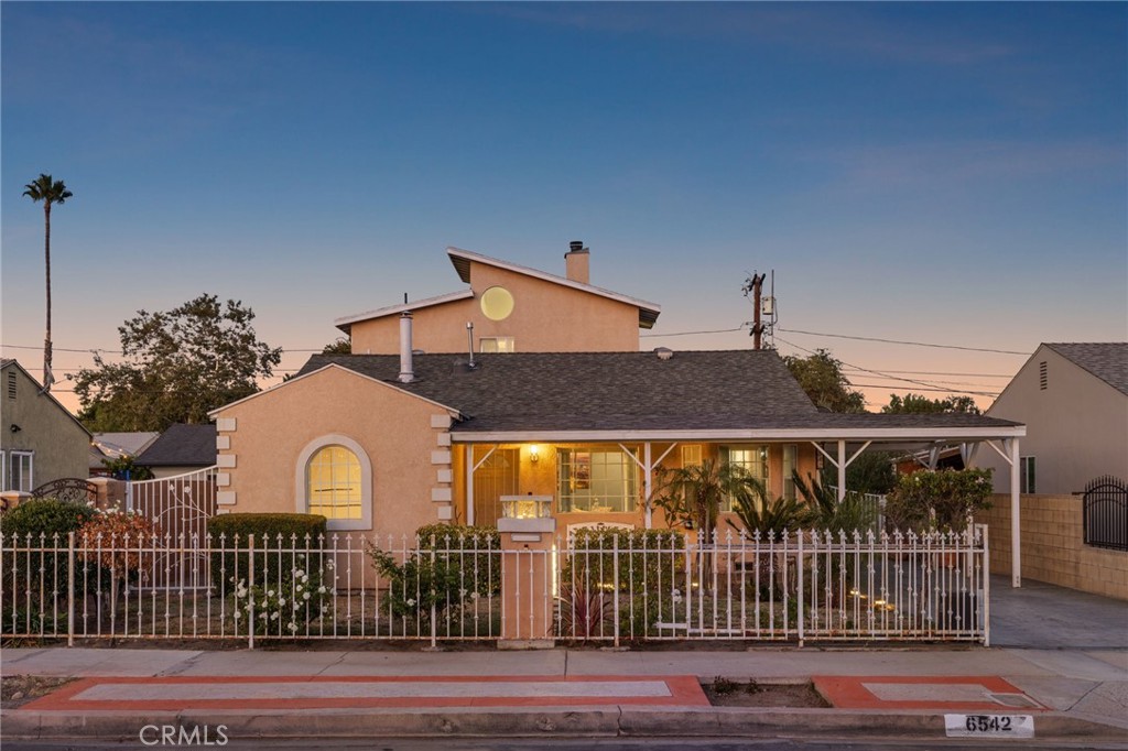 Located on a serene and idyllic street, in the highly desirable city of North Hollywood and exuding pride of ownership and custom touches throughout, this is the home for the most discerning of buyers. Spanning almost 1900 sq. ft of living space, spread out over two levels, you’ll enjoy comfort, quality and design touches the moment you turn the knob and enter your new home. From the quaint living room, to the custom kitchen, formal dining room and large family room with a wood burning fireplace, you’ll have plenty of space for those family gatherings. With two bedrooms, home office and bathroom downstairs, a private master retreat, complete with an oversized bedroom and en-suite bathroom on the second level, you’ll have the space and privacy a large family cherishes. To add to what’s already plentiful, a wet bar, surround sound, skylights, custom lighting, dual paned windows, electric gate, an oversized two car detached garage with a workshop and a backyard complete with fruit trees that are waiting for your personalized touches round out the specialness that this home evokes. Welcome to the endless possibilities of life in charming North Hollywood.