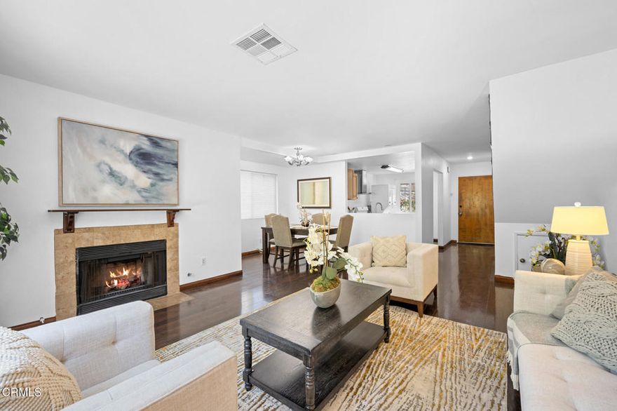 Situated just moments from the vibrant shops and dining along trendy Figueroa Street and near York Junction, this beautifully designed 2-story, 2-bedroom, 2-bath townhome offers the perfect blend of comfort, function, and lifestyle. The spacious living room with fireplace,  flows seamlessly into the dining area.  Glass doors open to an oversized backyard and side patio, a rare find and a true retreat for gardeners or those who love to entertain outdoors. Upstairs, you'll find two bedrooms and a full bath. The community features a large swimming pool, a spa and a picnic area. There are two designated subterranean side-by-side parking spaces and a private storage unit for added convenience. This home combines urban accessibility with a private, residential feel--don't miss the opportunity to make it yours!