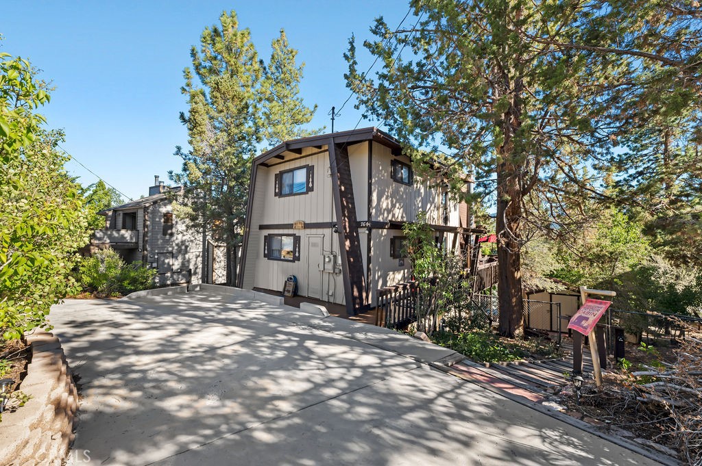 Panamint Mountain Drive is located in the highly sought-after community of Whispering Forest on an incredible interior lot with serene views of the mountains, slopes, and majestic surroundings. This charming home offers 1,636 sq. ft. of very comfortable living space with 4 bedrooms and 2.5 bathrooms, an inviting family room, and a dining room, along with an absolutely adorable kitchen. In addition, the property is currently functioning as a successful Airbnb!
Some of the most amazing features inside this home include open beam ceilings, wood paneling, stamped carpet throughout the main living space and bedrooms, an expansive sliding glass door, and a stone fireplace in the family room. The master suite offers a great walk-in closet, plus newer carpet and paint.
Panamint Mountain boasts a spacious multi-level wraparound deck extending from the front door to the back sliders, perfect for entertaining or soaking in the mountain views. The grounds are truly fantastic, offering a private spa with a separate deck area, a well-maintained shed, retaining planters, and plenty of mature trees for that true mountain feel.
This property can be sold furnished, making it ready for immediate enjoyment—whether you’re looking for a weekend family getaway, a permanent full-time residence, or an income-producing Airbnb. This is a fantastic home in an incredible location!