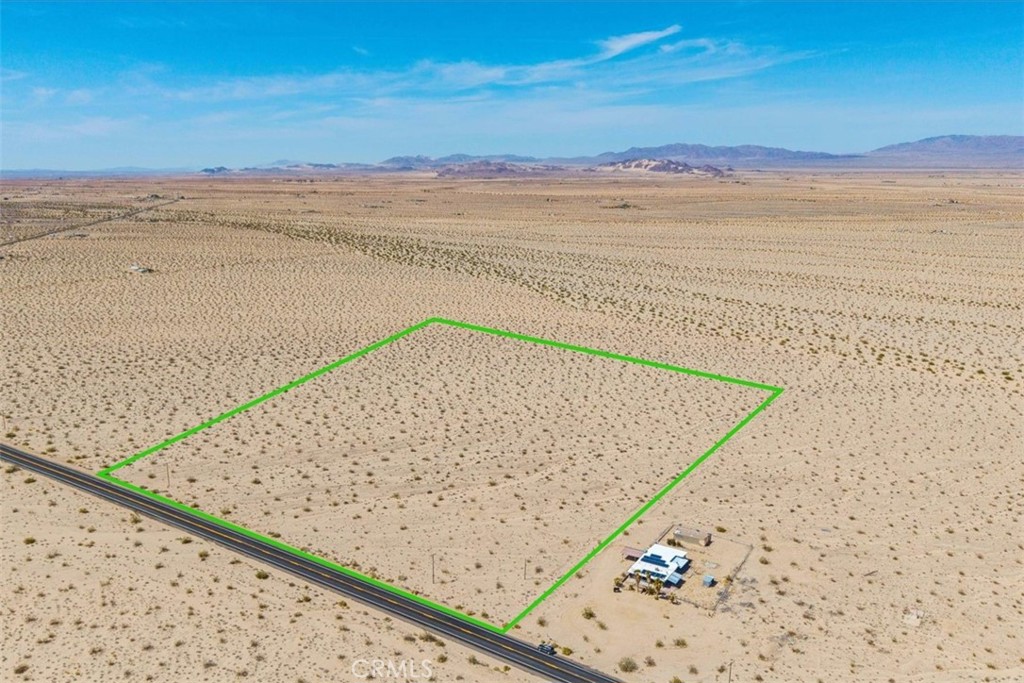 Calling all developers and Glampers. This property is 40 acres of flat land zoned RL-5 just off 29 Palms Hwy. You are far enough outside of town that you don't have the hassle of traffic and noise, but close enough that you can get your necessities, dine out, and have easy access to the National Park. For those who fly commuter planes, this property is conveniently located down the street from the airport, approximately 4 min. drive. This property can be subdivided into 8 (5-acre) estates. Perfect for equestrians, glampers, or luxury homes. Electric is on the property. Buyer to verify utilities, zoning, and building codes. This property is not located within city limits and is overseen by San Bernardino County.