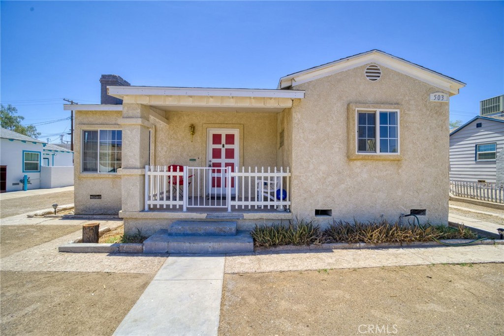 Charming 1940s home located in a small neighborhood of Needles, CA. This property features a grand master suite with a spacious bedroom, an office/ sitting area, and a separate bathroom. The guest bedroom is also spacious and features a guest bathroom. The eat-in kitchen boasts ample storage space in its numerous cabinets. The living room hosts a cozy wood-burning fireplace. You'll love the large backyard and the quaint, separated courtyard perfect for enjoying your morning coffee. This home also features a separate basement for your use, accessible via a separate exterior door. This home also features newer air conditioning, windows, and a roof. It is clean and ready for you to move in and make it your own.