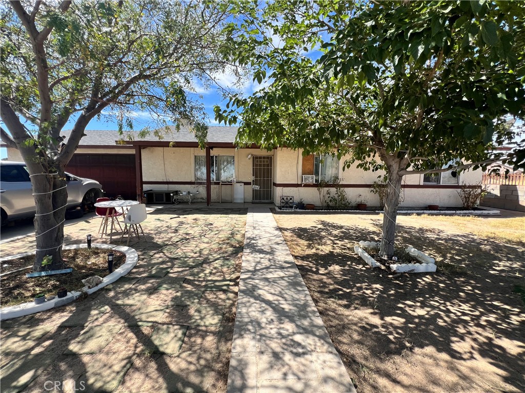 Great location!!! Single family home located across from Hacienda Elementary School and California City Middle School. This home has 3 bedrooms, 2 full baths, a 2 car attached garage and a huge .24 acre lot size. Property is fully fenced and gated. The interior features ceiling fans, mirrored closet doors, a large stone fireplace and new wood laminate flooring in bedrooms.