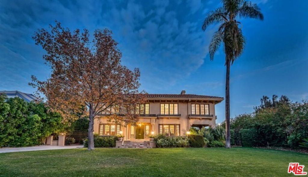 Welcome to 136 Fremont Place, an extraordinary Mediterranean-style residence nestled within the prestigious, gated community of Fremont Placecomplete with 24-hour security for peace of mind. Ideally located between Wilshire and Olympic Boulevards, just east of Highland Avenue, this home offers a rare blend of timeless architecture and modern luxury. Boasting 5 spacious bedrooms and 6 bathrooms, the home features expansive living areas with gleaming hardwood floors, a fully updated kitchen, and a dramatic staircase leading to a serene master suite. The main floor includes a versatile bedroom or maid's quarters, while the separate guest quarters above the garage provide additional privacy and comfort, Changing room.shower for the swimming pool. A bright breakfast room and inviting family room open onto a generous deck that overlooks a sparkling swimming poolperfect for entertaining or relaxing in your private oasis. The lush backyard is adorned with mature fruit trees, including persimmon and jujubee, and most windows and doors are fitted with double-paned glass for energy efficiency and tranquility. This move-in-ready gem is truly one of a kind, offering exceptional grounds, landscaping, and a unique blend of old-world charm and contemporary convenience.