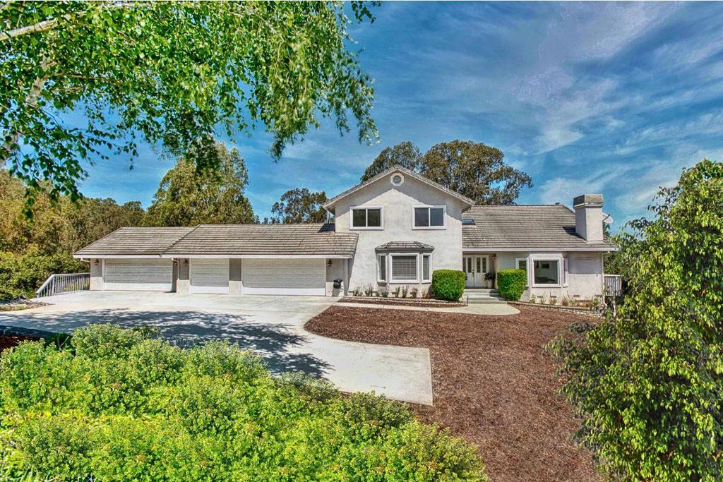 Welcome to 1650 Andreas Estates Place, a private gated sanctuary tucked into the rolling hills of Royal Oaks, California. Set on over 4 acres of secluded, tree-lined grounds, this estate offers complete privacy, no street noise, no prying eyes, just you and nature. Whether you're enjoying a quiet morning in the breakfast nook or relaxing in the backyard, the crown jewel of the home awaits: expansive wraparound decks that span the rear of the property, framing panoramic views of landscaped grounds and majestic oaks. These expansive outdoor spaces invite sunset dinners, weekend lounging, or simply breathing in the fresh country air. Inside, the home features 4 bedrooms, 4 baths, and an open floor plan flooded with natural light. With three fireplaces and a 5-car garage, it's built for both comfort and style. Just 10 minutes to Highway 101 and under an hour to Google and Apple offices in the South Bay. This is your perfect, secluded escape from the fast-paced Bay Area lifestyle. Centrally located only 30 minutes to Santa Cruz, the Monterey Peninsula, Carmel, and the Big Sur coastline. This is more than a home; it's a private escape designed for those who value space, beauty, and tranquility.