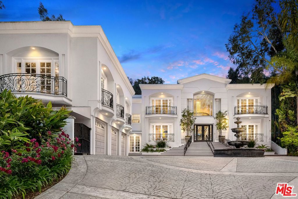 MAJOR $800,000. PRICE REDUCTION! At appx. $977 ppsf this impressive estate is by far the best buy on the Westside. Located in the celebrity-filled, 24HR guard-gated security enclave The Summit, and once the home of music icon P.Diddy! Classic & contemporary w/8650sqft of luxurious space set on a magnificent 2/3 acre, 30,000 sqft lot. Rarely found amenities include a 20-seat Theater for round the clock enjoyment, commanding curb appeal & fully gated circular motorcourt set back off the street for total privacy. The backyard is gorgeous w/stunning pool, verandas, huge lawns & majestic trees. The grand-scaled, bright interior w/7BRs & 7.50 BAs is in pristine, remodeled condition & features a dramatic entry, great chefs kitchen, spacious rooms, high ceilings, exceptional Master Suite, state of the art HVAC & CRESTON security & walls of sliding Fleetwood doors that capture serene treetop views. Offered w/all existing furnishings! see agent for details. SUBMIT ALL OFFERS, THIS IS VALUE!!