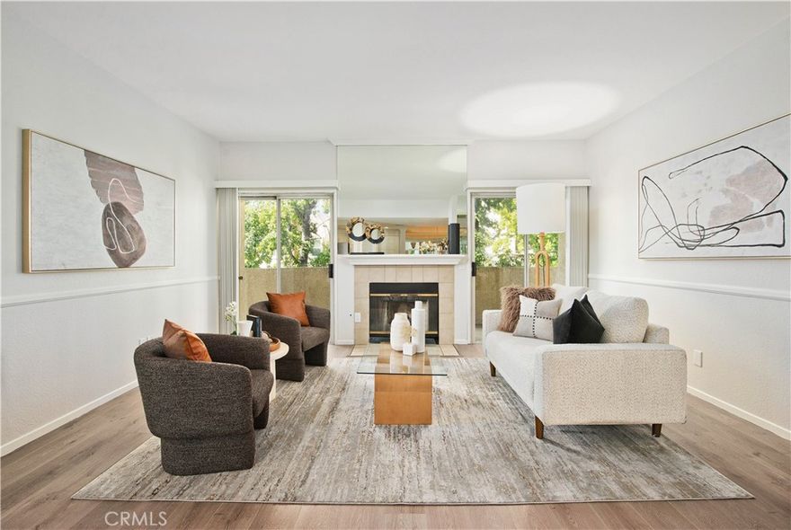 Look no further! This stunning residence in Chandler Park Village is ideally situated on a peaceful cul-de-sac street within the community’s most sought-after building. Bathed in natural light, this desirable corner unit offers beautiful views of mature trees and lush landscaping. Step inside to find spacious, open-concept living areas that include a formal dining space and an expansive living room anchored around its cozy fireplace, with direct access to a serene private balcony. The cook's kitchen features stainless steel appliances and a casual dining area — perfect for everyday living and entertaining. The well-designed layout includes two bedrooms located on opposite sides of the home, providing privacy and comfort. The expansive primary suite boasts a picturesque bay window, dressing area, enormous walk-in closet plus an additional wardrobe closet, and a spa-inspired bath with a makeup vanity and an oval soaking tub. Additional highlights include a full-size in-unit laundry including W&D, recently updated vinyl flooring, new carpet, new paint, designer updates, gated tandem parking, and private storage space.  Enjoy the resort-style community amenities such as multiple pools and spas, a BBQ area, and fitness center. Located just moments from premier dining, shopping, entertainment, and major freeways — this is a rare opportunity to call Chandler Park Village home!