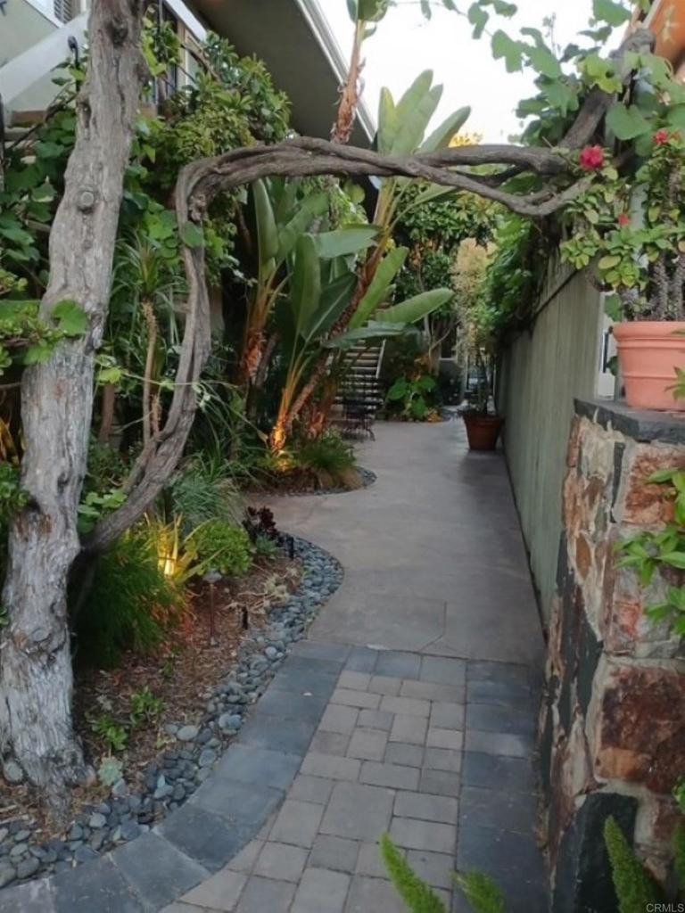 Stunningly remodeled in 2016. Tile flooring throughout except bedrooms. New carpet recently installed in both bedrooms. Beautiful open concept living space. Tile floors, Stacked washer/dryer at end of hallway by bathroom. New dishwasher recently installed. HUGE island with abundant cabinets. Gorgeous white cabinetry, gas stove. Sparkling dual pane windows. Unit sits at end of top floor offering privacy w/ wonderful view of oasis type courtyard. Seperate laundry room on property. Walkability is fantastic. Quintessential North Park vibe without the noise or crowds. Restaurants, shopping all close. 1 dedicated parking spot.