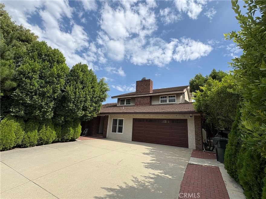 Executive Upland Residence with Guest Quarters and Elegant Finishes!

Welcome to this extraordinary and extensively customized single-family home. This traditional-elegance property features a spacious and light-filled open floor plan with vaulted ceilings, rich wood flooring, and crown molding throughout. Spanning approximately 4,000 sq. ft.+ the residence offers ample living space for comfort and entertainment.

Key Features: 5 bedrooms and 3 bathrooms (plus guest quarters), with two bedrooms and a full bath conveniently located on the main level. The upstairs master suite boasts a private sitting area and one of the home's three fireplaces. Enjoy a formal living room, a formal dining room, and a cozy family room featuring a wet bar and a fireplace. An enclosed patio area with French doors offers a seamless transition to the backyard. The kitchen is a chef's delight with a huge walk in pantry, granite counters, a gas range top, built-in appliances (including dishwasher, microwave, and range/oven), and a breakfast nook/dining area.

    Unique Amenity: A standout feature is the private guest quarters with a bathroom and its own separate entry, offering flexibility for extended family or a home office (the 1 car garage portion of the garage has been converted to a single).

    Outdoor Oasis: The backyard is an entertainer's dream, featuring a built-in BBQ, a gazebo, and a spa. 

The property includes a 2-car attached garage, central heating and cooling, a laundry room, dual pane windows, and security system features.

This turnkey home is situated on a large, level lot of nearly 10,000 sq. ft. in a neighborhood with pride of ownership and beautiful views.