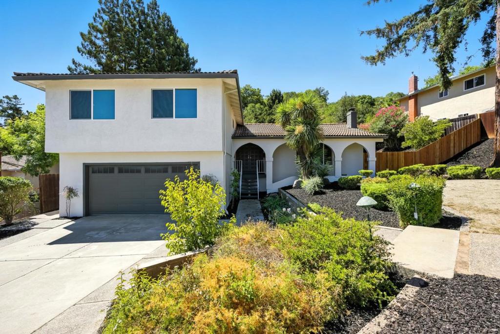 A manicured front porch welcomes you into this beautifully remodeled 4BD/3BA San Jose home, offering a spacious 2,219 sq ft open-concept layout. Inside, the living room immediately captures attention with an abundance of natural light and connects seamlessly to the heart of the home: a generous kitchen featuring a sleek island, marble countertops, stainless steel appliances, and a breakfast bar. Modern updates throughout, including elegant new flooring, central A/C, and forced air heating, make this home truly move-in ready. Just off the main level, a separate family room with a cozy fireplace offers added flexibility for gatherings, with sliding glass doors opening to a private backyard oasis, perfect for weekend get-togethers or relaxing afternoons. Upstairs, the serene primary suite boasts a spacious atmosphere, enhanced by natural light, along with an ensuite featuring double sinks, thoughtful finishes, and a walk-in closet. Three additional bedrooms and a well-appointed guest bathroom complete the upper level. With an expansive 8,960 sq ft lot, a 2-car garage, and a prime location near scenic trails and shopping centers, this turnkey home blends modern comfort with everyday convenience. Don't miss the opportunity to own this stunning home!