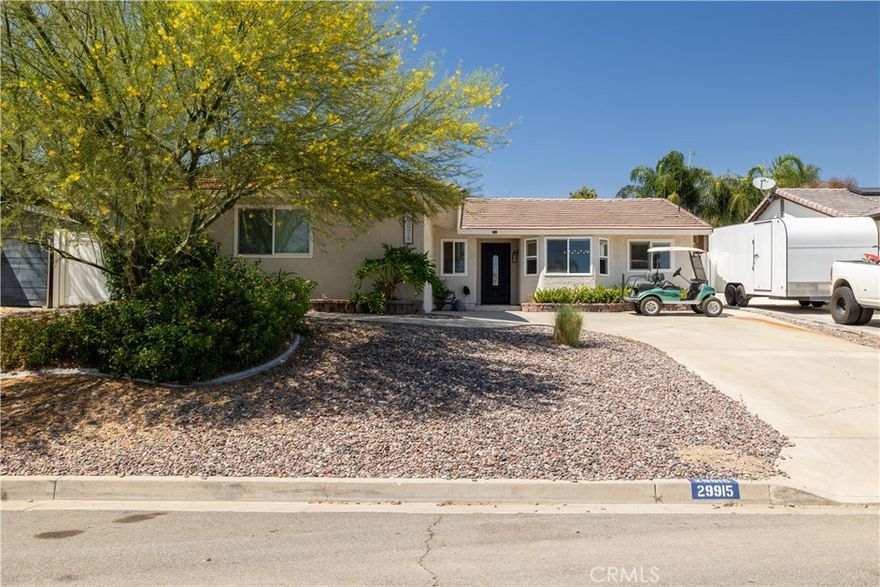 Welcome to your Canyon Lake retreat! This beautifully remodeled single-story home offers 3 bedrooms and 2 full bathrooms, perfectly blending modern upgrades with everyday comfort. Step inside to find luxury vinyl flooring throughout and a fully redesigned kitchen with quartz island, self-closing cabinetry, and newer appliances—ideal for both cooking and entertaining. The open-concept layout connects the kitchen, dining, and living areas, flowing seamlessly to a covered patio with views of the lush, low-maintenance two-tier backyard. Both bathrooms have been completely renovated, including a spa-inspired primary suite with a bidet, frameless glass shower with multiple water jets, and the convenience of a tankless water heater. Ceiling fans in all bedrooms add comfort year-round. Outdoors, a blooming wisteria shades the upper patio—a peaceful nook for morning coffee or evening gatherings. Fruit-bearing avocado, tangerine, and pear trees bring a touch of orchard living right to your door. As part of the exclusive 24-hour guarded Canyon Lake community, residents enjoy access to a private lake, golf course, pool, clubhouse, tennis courts, pickleball courts, equestrian center, and more. This move-in-ready gem is where charm meets modern convenience—perfect for living, relaxing, and entertaining. You don't want to miss it!