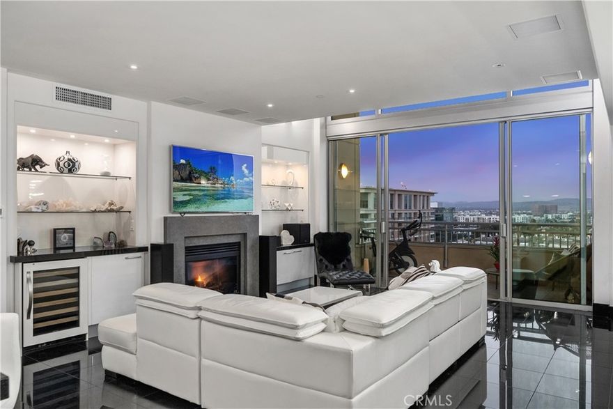 Situated in the exclusive 8000 building, this 9th-floor G Plan corner home occupies the most coveted and private corner in The Plaza-Irvine, offering panoramic views of city lights and beyond. With 2,131 sq. ft. of refined living space, this residence blends modern luxury with timeless elegance.

The open-concept main floor showcases luxury tile flooring, a cozy living room fireplace, and a seamless flow between the living, dining, and kitchen areas—perfect for entertaining. The gourmet kitchen features premium stainless steel appliances, a gas oven and cooktop, soft-closing cabinets and drawers, and sleek modern finishes. A stylish half bath completes the main level. Upstairs, the primary suite offers a true retreat with a loft overlooking the skyline, a spa-inspired bathroom with dual sinks, a walk-in shower, a soaking tub, and a spacious walk-in closet.



Residents of The Plaza-Irvine enjoy resort-style amenities, including a 5,000 sq. ft. fitness center with gym-grade equipment, steam rooms, a yoga room, cabana-lined Jr. Olympic pool with lap pool, massage room, two resident lobbies, two club rooms, two billiard rooms, a conference and business center, and 24-hour lobby attendants. Perfectly positioned in the heart of Irvine’s business district on the border of Irvine and Newport Beach, The Plaza offers unmatched convenience just moments from John Wayne Airport, UCI, Fashion Island, South Coast Plaza, and Crystal Cove.