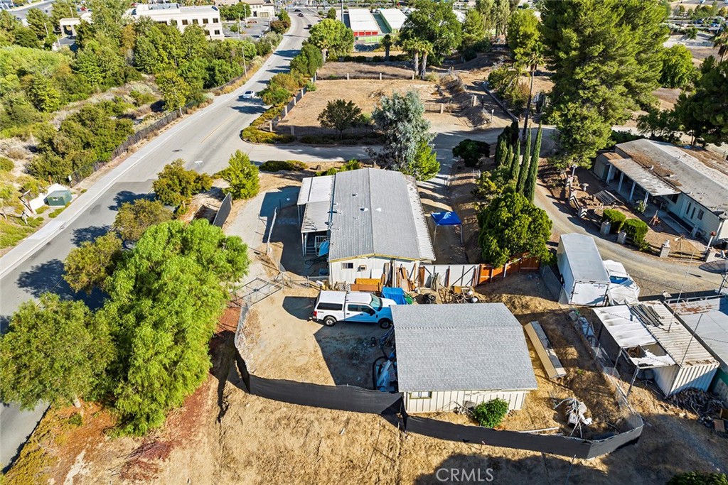 New zoning: Community Commercial property! Fantastic opportunity in Murrieta! Nothing but potential! Large corner lot all useable approx. .76 acres located near shopping, restaurants and easy access on and off the freeway! Mobile home on property not on a permanent foundation, approx. 1500 sq. feet 2/2. Property was previously zoned a residential and is now zoned as a Community Commercial property which can be used for a multitude of commercial uses. Call today to view.