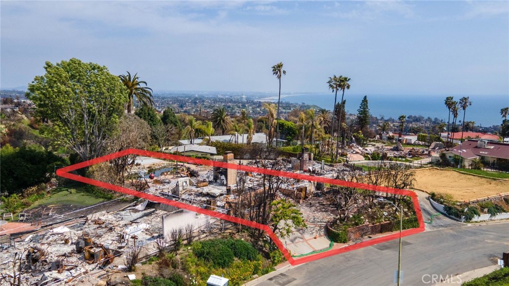Prime Pacific Palisades development opportunity with ocean views! This oversized, mostly flat, nearly 12,600 Sqft. lot. is located in the highly coveted Marquez Knolls neighborhood. Lot is fully cleared, Phase 1 and Phase 2 debris removal are complete. The previous 1 story structure was approximately 2,208 sqft. The property features an existing pool and is being sold as-is, offering a unique opportunity to build your dream home in this highly desirable pocket of Pacific Palisades. There may be potential to build a 2 story structure, buyer to do own due diligence to confirm. Located close to the beach and Palisades Village. Don't miss this rare opportunity to create something spectacular in Pacific Palisades! Not subject to the Palisades Geohazard Risk Assessment Zones.