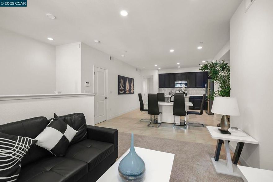 Welcome to this pristine 3-bedroom + den, 2-bath townhome offering 1,456 sq. ft. of comfortable living in the heart of Newark! Lightly lived in and in builder-provided condition, this home feels nearly brand new. The open-concept design creates a bright, airy feel that’s perfect for both daily living and entertaining with abundant natural light. A private balcony with serene sunrise views adds a peaceful retreat to your day. The chef-inspired kitchen is equipped with white shaker cabinetry, a modern mosaic tile backsplash, high-end stainless steel appliances, and an oversized island that doubles as a breakfast bar. Unlike many homes, the kitchen and dining areas feature elegant tile flooring, ensuring both style and durability. With three spacious bedrooms plus a den, this home offers flexibility for a home office, study, or guest space. The community is beautifully maintained and ideally located, AMC, Costco, parks, shopping, Dumbarton Bridge, I-880, and major tech campuses. Don’t miss the opportunity to call this stunning property your next home!