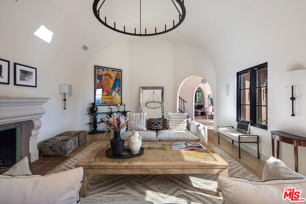 Perched above the world famous Sunset Strip, this remodeled and meticulously maintained villa mixes the excitement of being in the middle of it all, while also offering a relaxing and elegant lifestyle. Featuring an inspiring living room with vaulted ceilings and views of the city, open archways, loads of light, and an expansive, open concept kitchen, and dining area that takes in the city views. A sumptuous primary suite boasts a private balcony that offers a commanding south facing view of city lights and the boulevard below, a soaking tub, beautifully tiled steam shower, and expansive walk-in closet. Two additional en-suites and a conveniently located laundry room complete the upstairs. A sparkling pool, multiple entertaining areas, integrated sound, a main level bedroom/office and bath and gated parking for multiple cars make this a perfect home in the heart of the iconic strip.