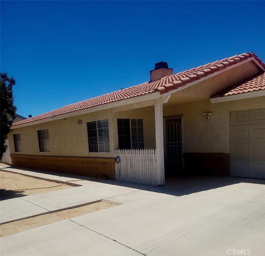 A Must-See Home with Pride of Ownership—Ready for Its New Owners!
This beautifully maintained 3-bedroom, 2-bathroom home offers 1,200 sq ft of comfortable living space on an oversized lot with RV access and parking—giving you endless possibilities for outdoor living, storage, or expansion.
The updated kitchen features newer stainless steel appliances, ample counter space, and generous cabinet storage. It opens to a cozy dining area, perfect for entertaining or family meals.
Step directly from the dining room into a custom semi-enclosed patio, ideal for weekend BBQs or relaxing while taking in the high desert sunsets. This space is enhanced by charming wood doors and shutters, hand-built by the homeowner for a warm, rustic touch.
In the spacious backyard, enjoy a custom-built playhouse (included with the home) and plenty of room to store your off-road vehicles, trailers, and desert toys. The front yard also offers a welcoming porch and open space, perfect for enjoying your morning coffee.
Additional Highlights:
Gated RV access to backyard
Vinyl fencing around the property
Cross-fenced for added functionality and privacy
Semi-enclosed patio for year-round enjoyment
Pride of ownership throughout
This home is priced right and won’t last long—perfect for first-time buyers, or those looking for room to roam.