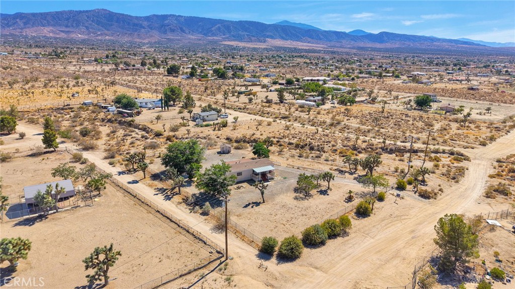 OPPORTUNITY!!Multi-Income on 4+ Acres in Phelan. Exceptional property at 1525 Del Rosa Rd A,B, & C, offers three mobile homes on over four sprawling acres, presenting an incredible investment opportunity or multi-generational living solution. The main residence features open floor plan, large living room, four bedrooms, two bathrooms and potential for an attached ADU, while two additional units (2BR/2BA and 2BR/1BA) provide immediate rental income or flexjavascript:__doPostBack('m_rpPageList$ctl02$lbPageLink','')ible living arrangements. Located in the rapidly growing community of Phelan, you'll enjoy the perfect balance of rural tranquility and urban accessibility—just minutes from the 15 freeway for easy commutes to Los Angeles, San Bernardino, or Las Vegas. The expansive acreage offers endless possibilities: create your own private compound, develop additional structures, house horses or livestock, or simply enjoy the freedom of wide-open desert living under stunning starlit skies. With Phelan's affordable cost of living, no HOA restrictions, and proximity to outdoor recreation in the San Bernardino Mountains, this property delivers the ultimate high desert lifestyle with serious income potential. Don't miss this rare opportunity to own multiple income streams on premium acreage in one of Southern California's most promising growth markets! Snowline School District.