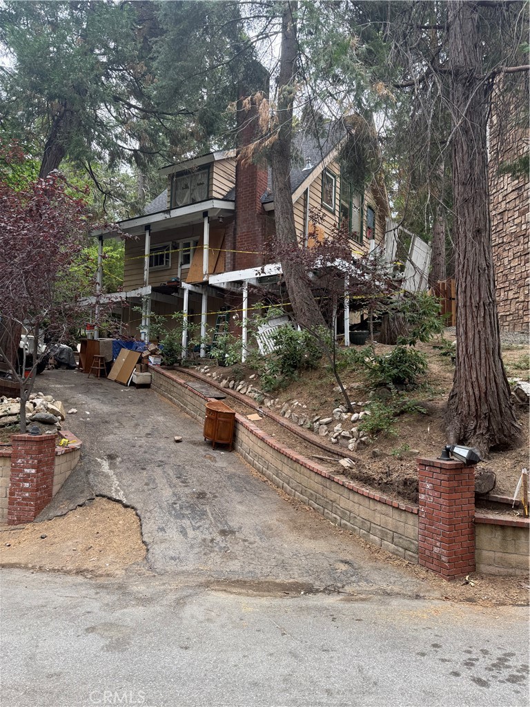 A rare opportunity to own in the highly sought after Palisades, with lake rights, this John Muir Road property sits directly across the street from Orchard Bay, and surrounded by multi-million-dollar homes. While the residence is a fixer in need of transformation, its location is undeniable—first-tier proximity to the water, ALA access, and minutes from the Village, shopping, restaurants, and entertainment.
The Palisades is known for its enduring appeal, with homes often held by families for decades, creating traditions that span generations. Here, life unfolds with the rhythm of the seasons—snow days in winter, boating in summer, and year-round hiking and exploring under the pines. Visits to Santa’s Village add a touch of magic, while evenings call for gathering around the fireplace with a mug of cocoa. It’s a property that invites you to slow down, make memories, and build a legacy in Lake Arrowhead.