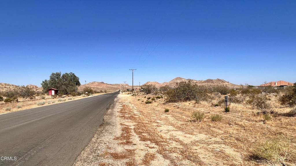 Residential buildable 2.27 acres of Flat Vacant Land on a paved street. Ready to build your dream home. Five minutes drive from Rosamond city center and nine minutes from Hwy 14. short distance drives' from Edward's Air force Base & Tehachapi. Power & Telephone services connected in the street. Water connection is not available. Buyer will need to install well. Sellers will consider carry back certain amount.