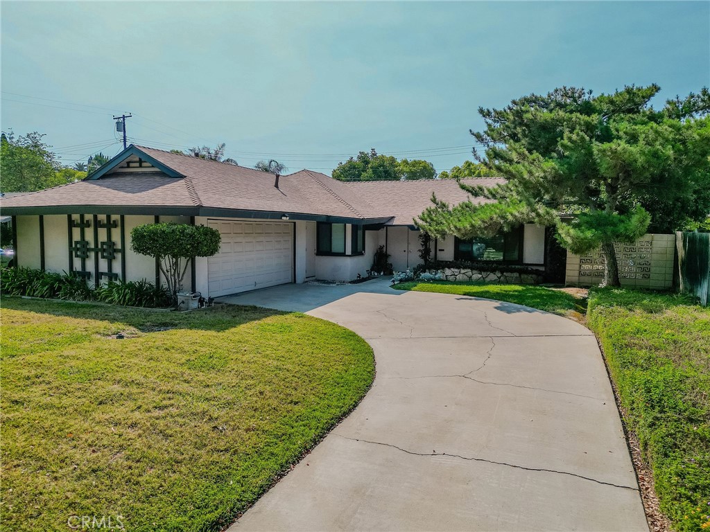 Looking for a beautiful home on a tree-lined street? You’ve found it! This charming single-story home at 8214 Sherwood Pl, Riverside, CA 92504 features 3 bedrooms and 2 bathrooms with fantastic curb appeal. Step through the double-door entry into a spacious living room highlighted by a stunning stone wood-burning fireplace. The formal dining room is perfect for a large dining set, and just beyond is the kitchen with quality cabinetry, attractive countertops, and well-maintained appliances.
The primary bedroom offers its own private bath, and the enclosed patio provides a versatile space for relaxing, entertaining, or even gardening. Outside, enjoy a backyard filled with mature, producing fruit trees. And there’s more...this home comes with a nearly new roof, updated AC and heating units, and all cold water pipes replaced for peace of mind. This property has been well-loved and cared for; come see for yourself!