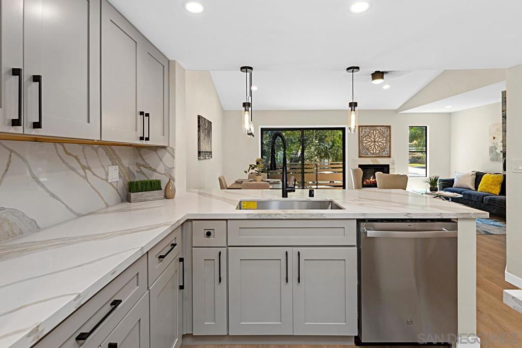 Beautifully remodeled 2-bedroom condo in Scripps Ranch! This spacious 942 sq ft home features an open floor plan, with vaulted ceilings and offers modern style and comfort with a freshly updated kitchen featuring sleek taupe cabinetry, quartz countertops and backsplash, and stainless steel appliances. The bathroom has been tastefully upgraded with custom tile finishes, and the entire unit boasts new flooring, fresh paint, new doors, and updated carpentry. Enjoy a private balcony that looks out onto a peaceful, tree-lined community. The well-maintained complex includes multiple pools and is conveniently located near the 15 freeway, shopping, dining, and just a short drive to San Diego’s world-class beaches. A perfect blend of convenience, tranquility, and modern living! Come quick before this one is gone!