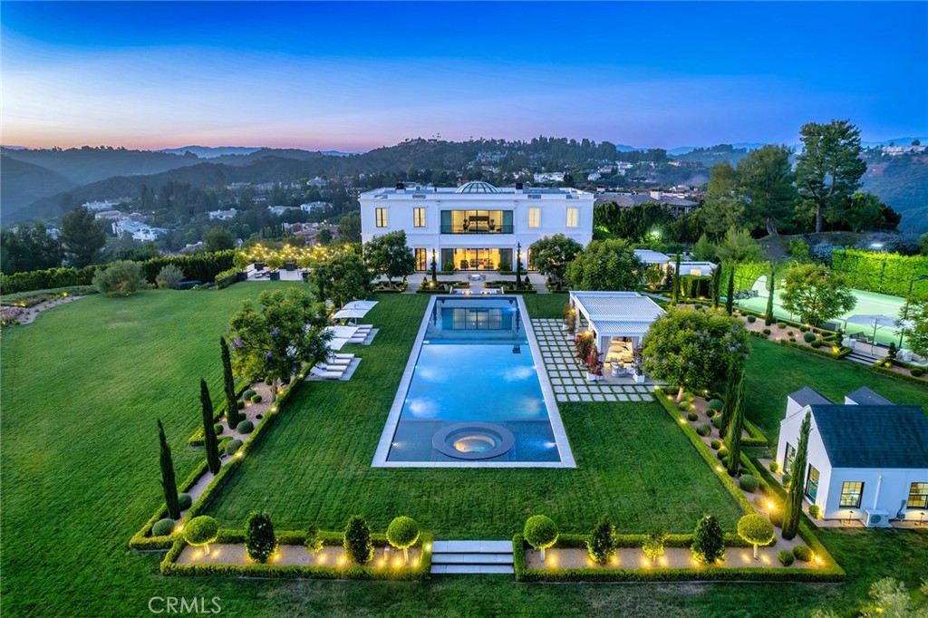 The ultimate trophy estate! A world class European masterpiece that has been recently reimagined and professionally designed to absolute perfection! Ideally located behind massive private gates within the prestigious guard gated community, Bel Air Crest. This landmark estate is set on over 3.5 usable acres and boasts panoramic views with exceptional total privacy! Spanning 17,254 square feet with every amenity desired and expected for a home of this caliber. Features include a dramatic grand entry enhanced by a 35 foot custom glass domed ceiling. The all new center island kitchen opens seamlessly to the family room and is graced with new glass pocket doors, fireplace and views. Upstairs there is an epic primary suite with commanding jet liner views, fireplace, two walk in closets and an all new Four Seasons quality bathroom. There are 5 more en-suite bedrooms on this level. The lower level is an entertainers dream! There is a state of the art theater, huge game room and lounge, wet bar, wine cellar, gym with separate massage room, and a hair salon/barber shop! The resort quality grounds are second to none! There is an amazing Olympic sized pool, tennis court with lights, chef's outdoor kitchen, two bathrooms, custom built children's playhouse with its own HVAC, batting cage, pool cabanas, vegetable garden, multiple fire features, outdoor wellness center with cold plunge and sauna and massive manicured lawns all with unobstructed views and complete privacy. Other amenities include an elevator, tremendous solar array, smart home system, all new doors and windows, huge motor court big enough for 30+ cars and so much more! One of Los Angeles' finest properties! A very special offering!