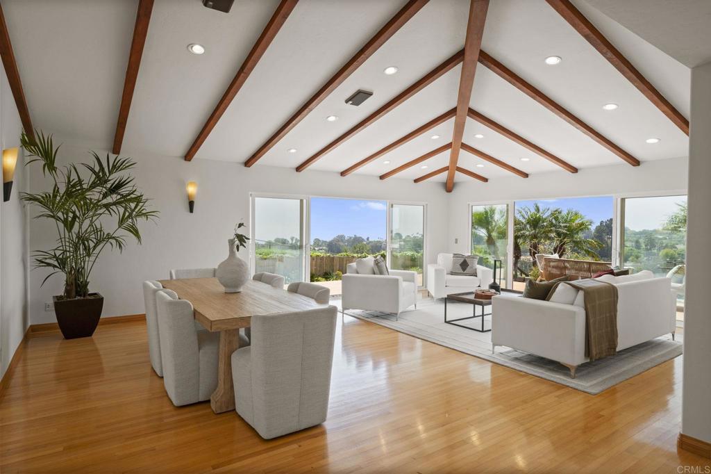 EXQUISITE PRIVATE HILLTOP RETREAT WITH PANORAMIC OCEAN VIEW! This custom-built Muirlands Crest estate offers spectacular coastline and lush canyon views from nearly every window of the home as well as from its expansive private deck. Perfectly situated on a huge 21,000 sf lot at the end of an exclusive five-home private drive, this property is on the market for the first time in 57 years. This open-concept home features formal entry, plenty of oversized windows and sliders, soaring ceilings, gleaming hardwood floors, custom built-ins in each of the generous-sized bedrooms, and a gorgeous chef's kitchen. Cozy up in front of the kiva-style gas FP in the adjacent family room. Step outside onto the sizable, shaded patio with vertical garden. A flexible floor plan offers two primary suites, one on each level. The light-filled upper suite has a roomy open bath, walk-in closet and dressing room, dedicated WFH space, and a sitting area in the sunroom with views of the sparkling coastline waters all the way to Mexico! The lower half of the property boasts a terraced fruit orchard with 30+ mature trees while palm-drenched, drought-tolerant landscaping surrounds the home. Everything is on automated irrigation for easy maintenance. Other features include fully-owned rooftop solar with net positive output, drinking water filtration system, and 2 car garage with dedicated outlet for your EV as well as W/D hookups. This freshly painted home is move-in ready or can be reimagined to maximize the potential of this truly unique parcel. This is your opportunity to own a glorious piece of SoCal heaven!