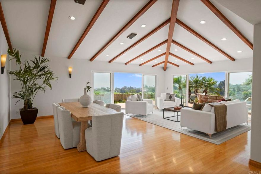 Exceptional New Price with $395,000 Price Reduction! EXQUISITE PRIVATE HILLTOP RETREAT WITH PANORAMIC OCEAN VIEW! This custom-built Muirlands Crest estate offers spectacular coastline and lush canyon views from nearly every window of the home as well as from its expansive private deck. Perfectly situated on a huge 21,000 sf lot at the end of an exclusive five-home private drive, this property is on the market for the first time in 57 years. This open-concept home features formal entry, plenty of oversized windows and sliders, soaring ceilings, gleaming hardwood floors, custom built-ins in each of the generous-sized bedrooms, and a gorgeous chef's kitchen. Cozy up in front of the kiva-style gas FP in the adjacent family room. Step outside onto the sizable, shaded patio with vertical garden. A flexible floor plan offers two primary suites, one on each level. The light-filled upper suite has a roomy open bath, walk-in closet and dressing room, dedicated WFH space, and a sitting area in the sunroom with views of the sparkling coastline waters all the way to Mexico! The lower half of the property boasts a terraced fruit orchard with 30+ mature trees while palm-drenched, drought-tolerant landscaping surrounds the home. Everything is on automated irrigation for easy maintenance. Other features include fully-owned rooftop solar with net positive output, drinking water filtration system, and 2 car garage with dedicated outlet for your EV as well as W/D hookups. This freshly painted home is move-in ready or can be reimagined to maximize the potential of this truly unique parcel. This is your opportunity to own a glorious piece of SoCal heaven!
