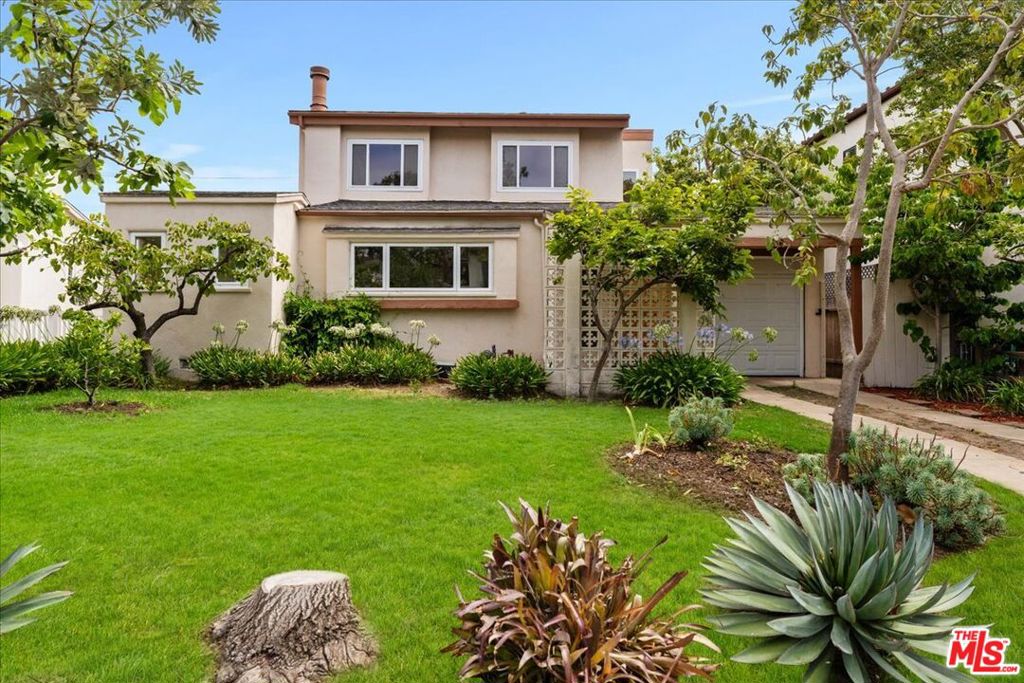 Beautifully refreshed 4 bedroom/2 Bathroom house in the heart of Brentwood with a spacious backyard, original details, and washer/dryer. Located centrally within Brentwood, this home is a few blocks to the Brentwood Farmer's Market, the many trendy shops and cafes on San Vicente Blvd and Wilshire Blvd, and a short distance to Santa Monica, West LA, Westwood, and most parts of the Westside. Living spaces feature original hardwood flooring, lots of natural sunlight, recessed lighting, and a large living room. Dining room is separate from the kitchen and off the living room. The kitchen features white tile countertops and backsplash, real wood cabinetry, tile flooring, a full set of brand-new stainless-steel appliances, and lots of cabinet room for storage. Laundry area is off the kitchen and features side by side washer/dryer. Downstairs bedroom off the kitchen is spacious and has direct access to the backyard. Other downstairs bedrooms have original details and ceiling light/fans. Upstairs is a loft area/family room with a massive patio and tree top views. Primary bedroom is spacious, has vaulted ceilings, and mirrored sliding glass closet doors. Also, upstairs is a bonus room with a sink that would make an excellent office/workstation. Upstairs bathroom features a shower tub combo with white tile shower walls. Backyard is spacious and provides tons of space to make your own and entertain. Driveway fits two cars. Street parking is permit only. Garage provides lots of room for storage. Enjoy a newly updated home in Prime Brentwood!
